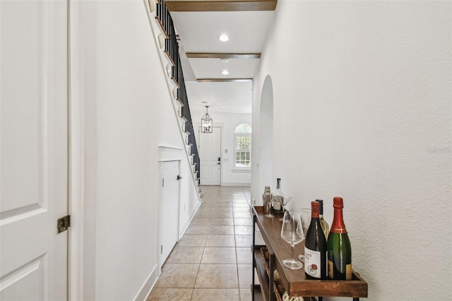 407 S Fremont Ave Unit B, Tampa, FL 33606 - hall with arched walkways, light tile patterned floors, recessed lighting, and baseboards