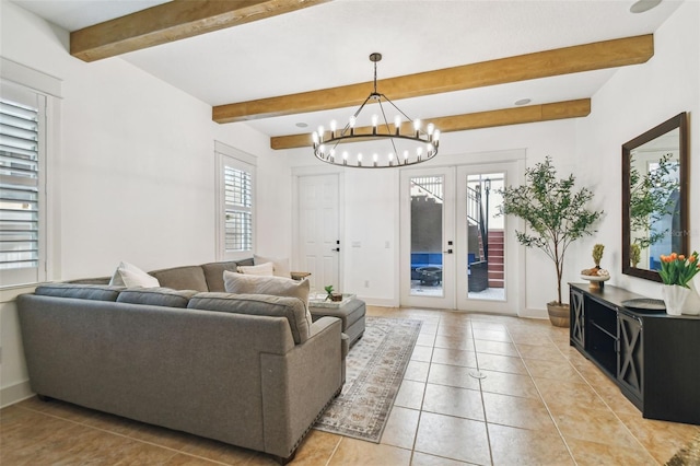 407 S Fremont Ave Unit B, Tampa, FL 33606 - living room featuring light tile patterned flooring, beam ceiling, a chandelier, baseboards, and french doors