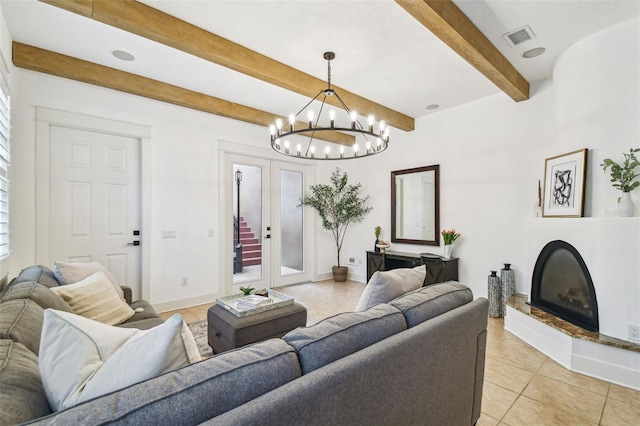 407 S Fremont Ave Unit B, Tampa, FL 33606 - living room featuring beamed ceiling, a chandelier, light tile patterned floors, baseboards, and a fireplace with raised hearth
