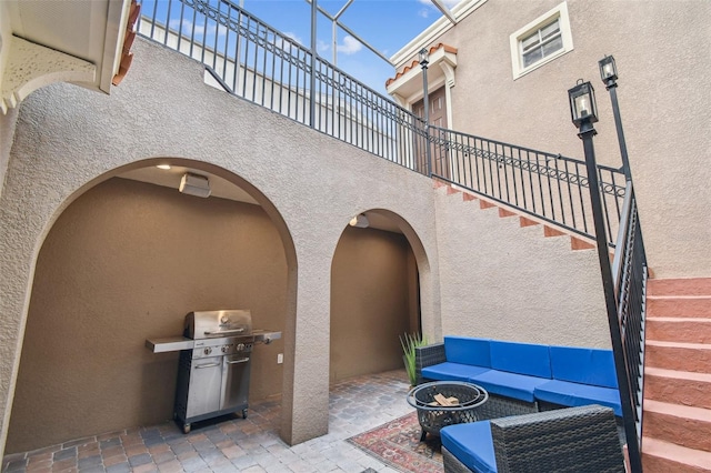 407 S Fremont Ave Unit B, Tampa, FL 33606 - view of patio / terrace with a grill, stairs, and an outdoor living space with a fire pit
