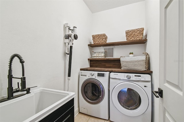 407 S Fremont Ave Unit B, Tampa, FL 33606 - washroom featuring washer and dryer and light tile patterned flooring