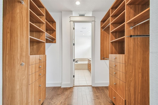 407 S Fremont Ave Unit B, Tampa, FL 33606 - walk in closet featuring wood finished floors