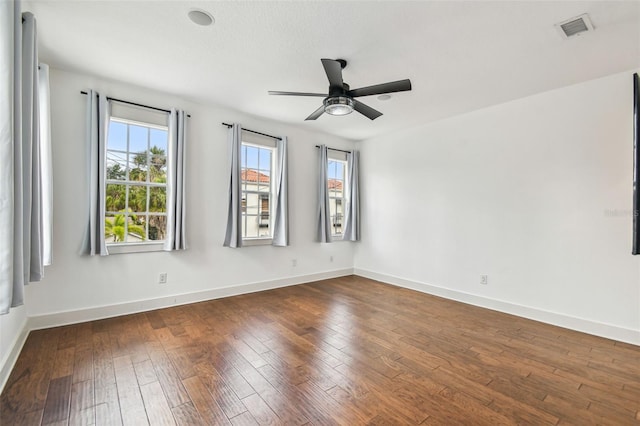 407 S Fremont Ave Unit B, Tampa, FL 33606 - empty room with ceiling fan, dark wood-type flooring, and baseboards
