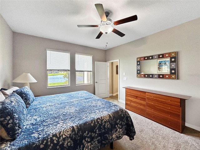16913 Anchor Root St, Wimauma, FL 33598 - bedroom featuring light colored carpet, baseboards, and ceiling fan