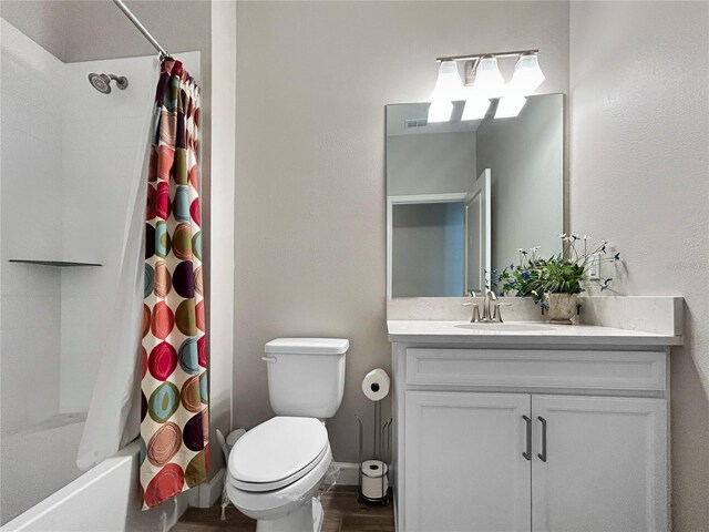 16913 Anchor Root St, Wimauma, FL 33598 - full bath with vanity, toilet, shower / bath combination with curtain, baseboards, and wood finished floors