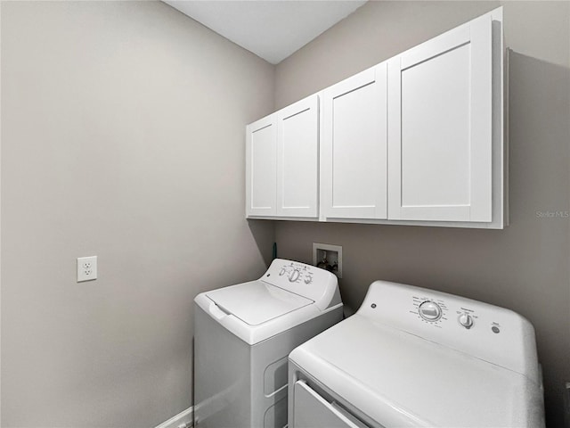 16913 Anchor Root St, Wimauma, FL 33598 - laundry area featuring cabinet space, independent washer and dryer, and baseboards
