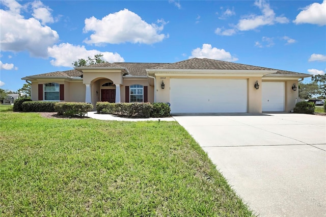 12012 Cromwell Way, Spring Hill, FL 34609 - view of front of property with concrete driveway, a garage, stucco siding, and a front yard