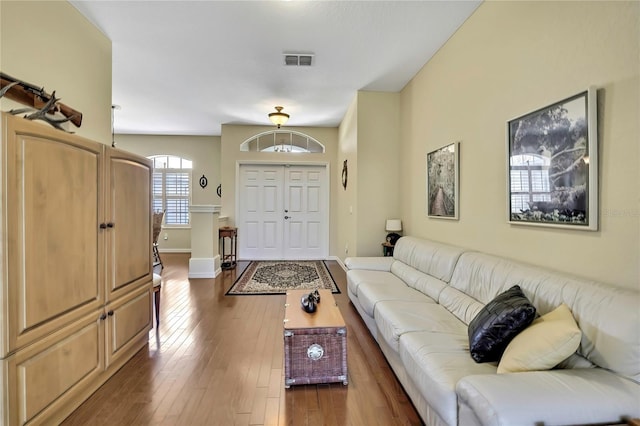 12012 Cromwell Way, Spring Hill, FL 34609 - living room with dark wood-style floors and baseboards