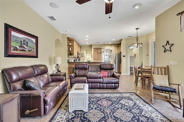 12012 Cromwell Way, Spring Hill, FL 34609 - living room with ceiling fan, light tile patterned floors, recessed lighting, and arched walkways