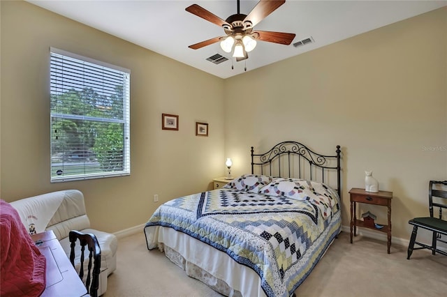 12012 Cromwell Way, Spring Hill, FL 34609 - bedroom featuring baseboards, light colored carpet, and a ceiling fan