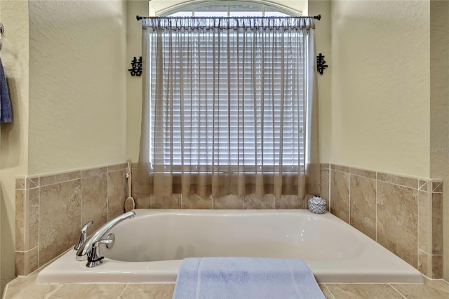12012 Cromwell Way, Spring Hill, FL 34609 - bathroom featuring a bath and a textured wall
