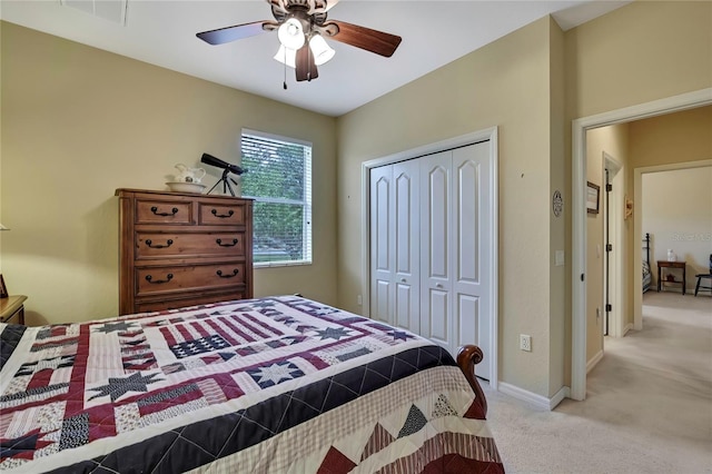 12012 Cromwell Way, Spring Hill, FL 34609 - bedroom featuring light carpet, a closet, ceiling fan, and baseboards