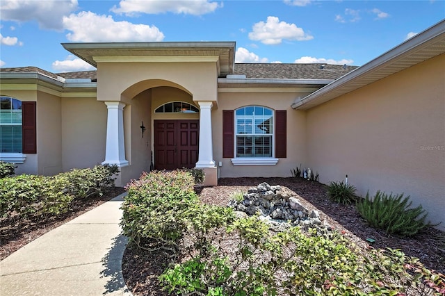 12012 Cromwell Way, Spring Hill, FL 34609 - entrance to property featuring stucco siding and roof with shingles