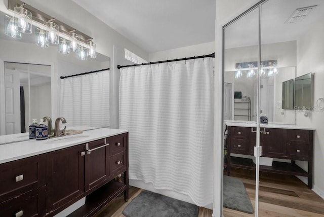 5865 Meadowpark Pl, Lithia, FL 33547 - full bath with wood finished floors and vanity