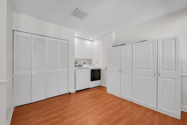 5865 Meadowpark Pl, Lithia, FL 33547 - kitchen with washer / dryer, light wood-style floors, and recessed lighting