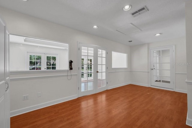 5865 Meadowpark Pl, Lithia, FL 33547 - unfurnished room featuring wood finished floors, attic access, baseboards, and recessed lighting