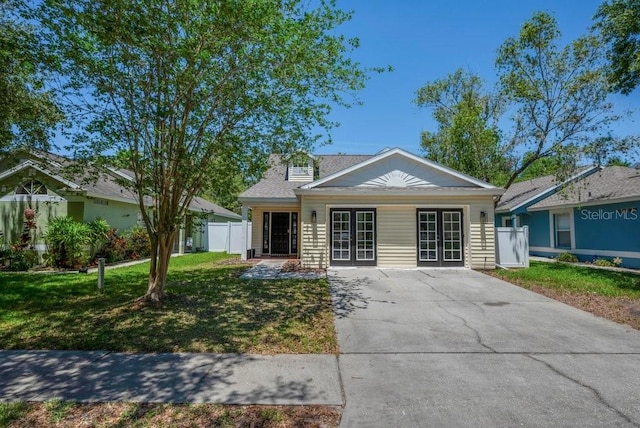 5865 Meadowpark Pl, Lithia, FL 33547 - view of front of house with french doors and concrete driveway