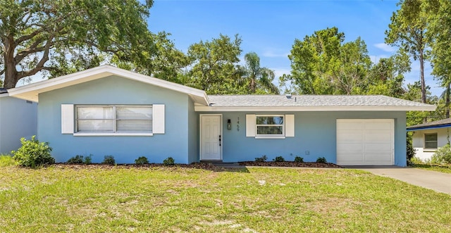 1459 Joel Ln, Clearwater, FL 33755 - single story home with a garage, driveway, stucco siding, and a front yard