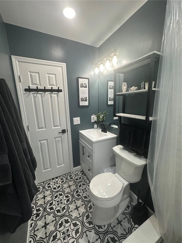 1459 Joel Ln, Clearwater, FL 33755 - bathroom with toilet, vanity, and baseboards