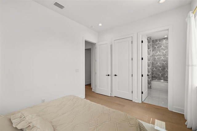403 E Davis Blvd, Tampa, FL 33606 - bedroom with wood finished floors, recessed lighting, and connected bathroom