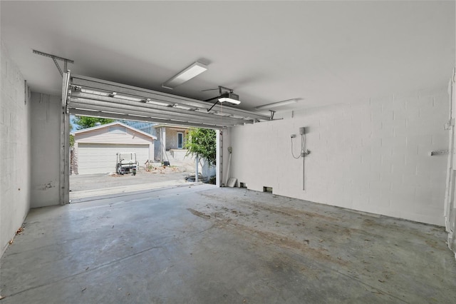 403 E Davis Blvd, Tampa, FL 33606 - garage featuring a garage door opener and concrete block wall