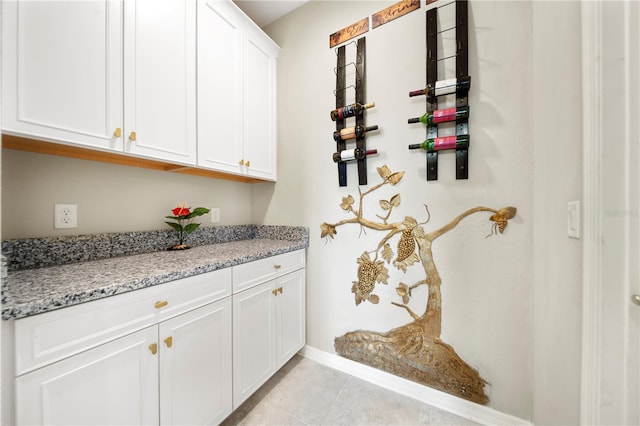 4917 Eagle Rock Dr, Wimauma, FL 33598 - bar featuring baseboards and light tile patterned floors