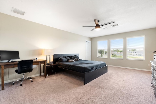4917 Eagle Rock Dr, Wimauma, FL 33598 - bedroom with light carpet, baseboards, ceiling fan, and a closet