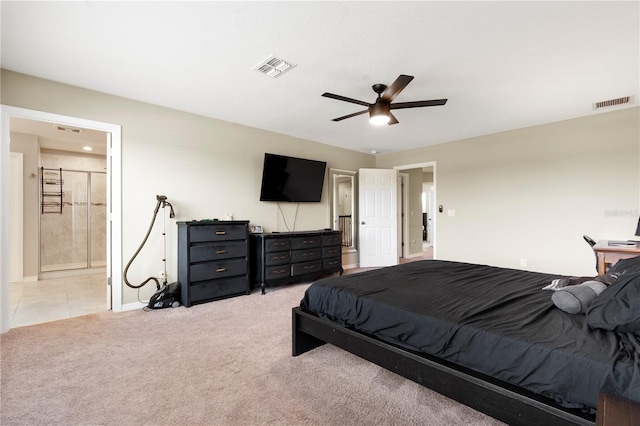 4917 Eagle Rock Dr, Wimauma, FL 33598 - bedroom with light colored carpet, baseboards, ceiling fan, and ensuite bathroom