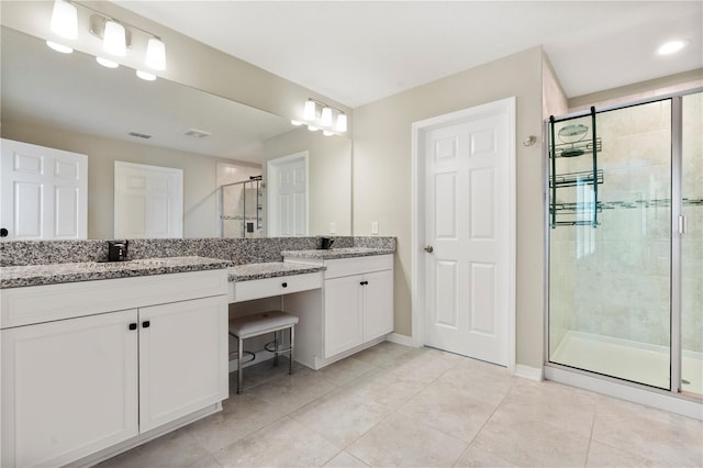 4917 Eagle Rock Dr, Wimauma, FL 33598 - full bathroom featuring a shower stall, tile patterned floors, vanity, and baseboards