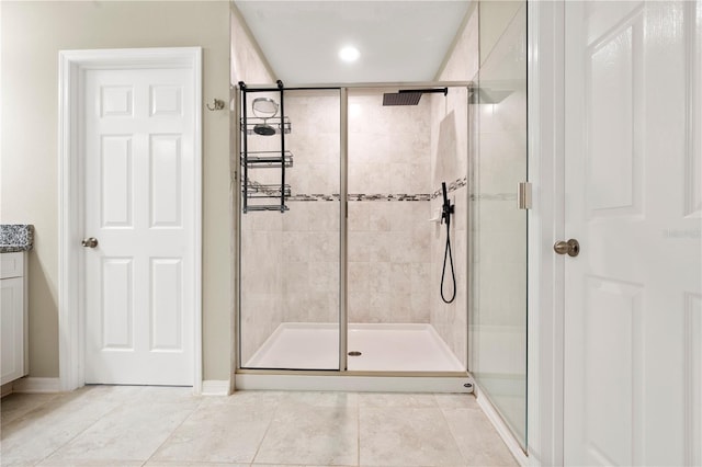 4917 Eagle Rock Dr, Wimauma, FL 33598 - full bath featuring a stall shower, tile patterned flooring, vanity, baseboards, and recessed lighting