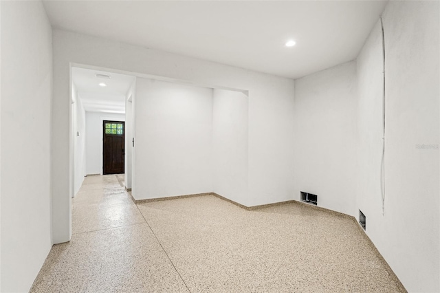 2200 N Glenwood Dr, Tampa, FL 33602 - empty room featuring recessed lighting and dark speckled floor