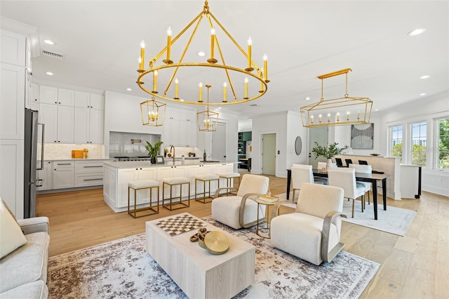 2200 N Glenwood Dr, Tampa, FL 33602 - living area with a chandelier, light wood finished floors, and recessed lighting