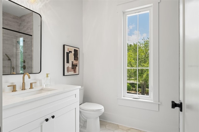 2200 N Glenwood Dr, Tampa, FL 33602 - full bath with vanity, a tile shower, toilet, and baseboards