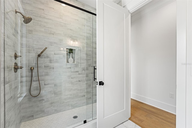 2200 N Glenwood Dr, Tampa, FL 33602 - full bathroom with a shower stall, wood finished floors, and baseboards