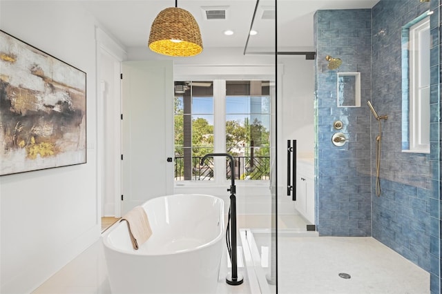 2200 N Glenwood Dr, Tampa, FL 33602 - full bath featuring a freestanding bath, tiled shower, and recessed lighting