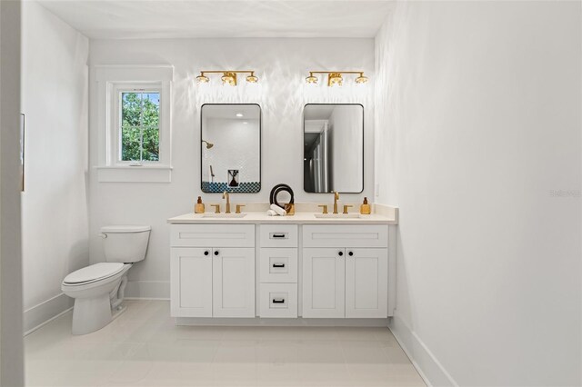 2200 N Glenwood Dr, Tampa, FL 33602 - full bath featuring double vanity, toilet, baseboards, a shower, and tile patterned floors