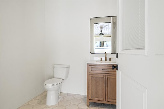 2200 N Glenwood Dr, Tampa, FL 33602 - bathroom with vanity, toilet, and tile patterned flooring