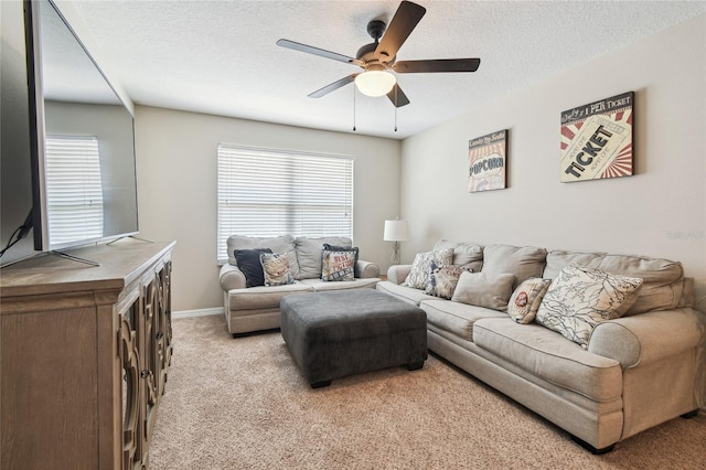 3530 Brook Crossing Dr, Brandon, FL 33511 - living room with ceiling fan, light carpet, plenty of natural light, a textured ceiling, and baseboards