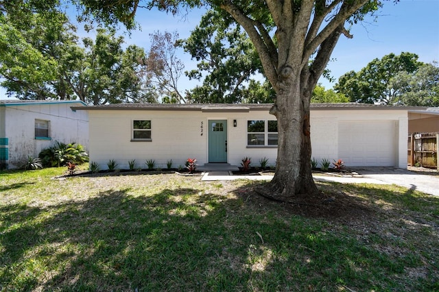 5624 62nd St N, Saint Petersburg, FL 33709 - ranch-style house with driveway, a front lawn, and a garage