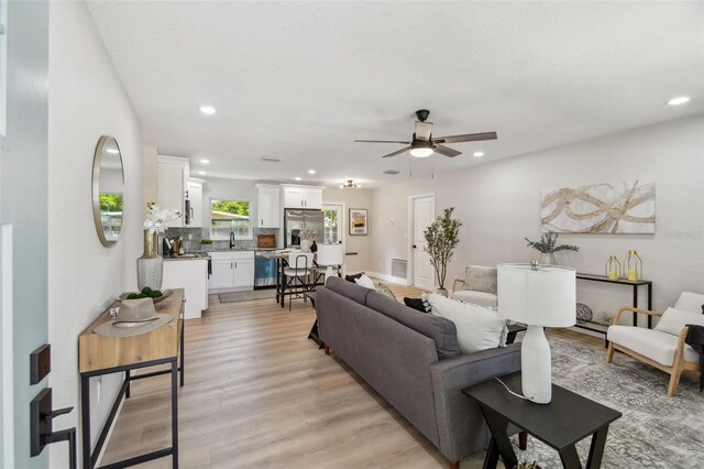 5624 62nd St N, Saint Petersburg, FL 33709 - living area with ceiling fan, light wood finished floors, and recessed lighting