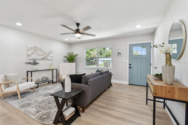 5624 62nd St N, Saint Petersburg, FL 33709 - living room with ceiling fan, light wood-style floors, recessed lighting, and baseboards