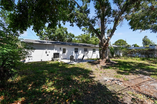 5624 62nd St N, Saint Petersburg, FL 33709 - rear view of house featuring a patio area and central air condition unit