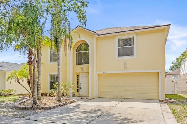 10311 Frog Pond Dr, Riverview, FL 33569 - view of front facade with an attached garage, driveway, and stucco siding