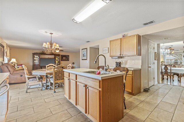 10311 Frog Pond Dr, Riverview, FL 33569 - kitchen with a chandelier, open floor plan, light countertops, and light tile patterned flooring