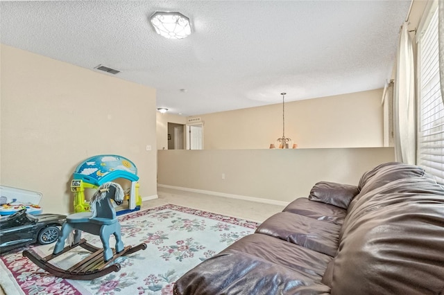 10311 Frog Pond Dr, Riverview, FL 33569 - carpeted living area with a textured ceiling and baseboards