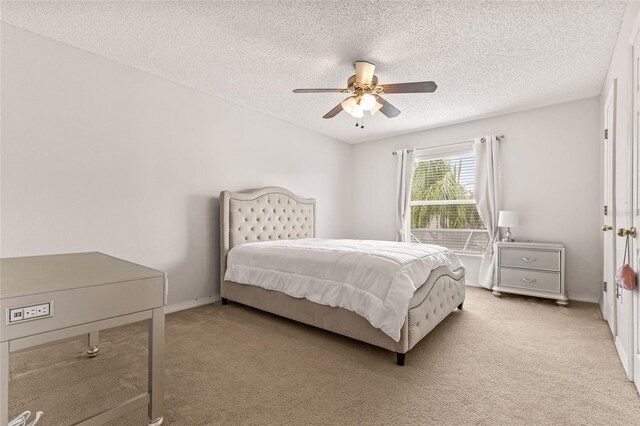 10311 Frog Pond Dr, Riverview, FL 33569 - bedroom featuring light colored carpet, a textured ceiling, a ceiling fan, and baseboards