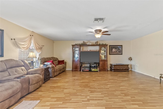 10311 Frog Pond Dr, Riverview, FL 33569 - living area featuring light wood-style flooring, ceiling fan, and baseboards