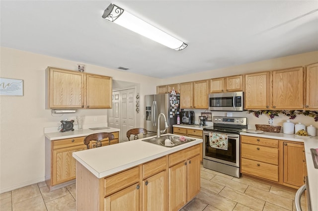 10311 Frog Pond Dr, Riverview, FL 33569 - kitchen with stainless steel appliances, light brown cabinets, and a sink
