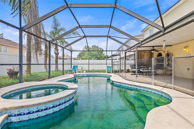 10311 Frog Pond Dr, Riverview, FL 33569 - view of pool with a patio, a fenced backyard, glass enclosure, and a pool with connected hot tub