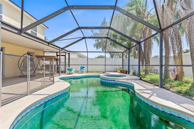 10311 Frog Pond Dr, Riverview, FL 33569 - view of swimming pool with a patio area, a fenced backyard, a lanai, and a pool with connected hot tub